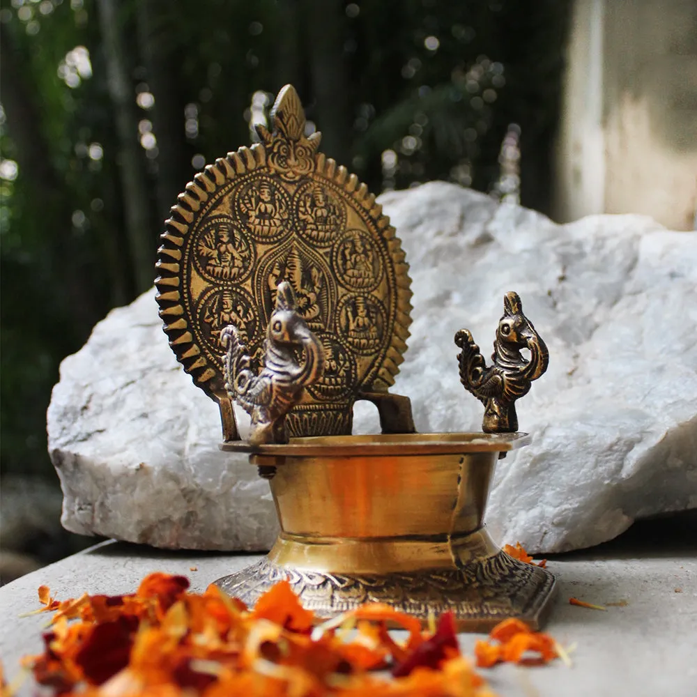 Traditional Ashtalakshmi Vilakku - Divine Brass Oil Lamp With Peacocks. Ht 19 cm x W 12 cm x L 15 cm